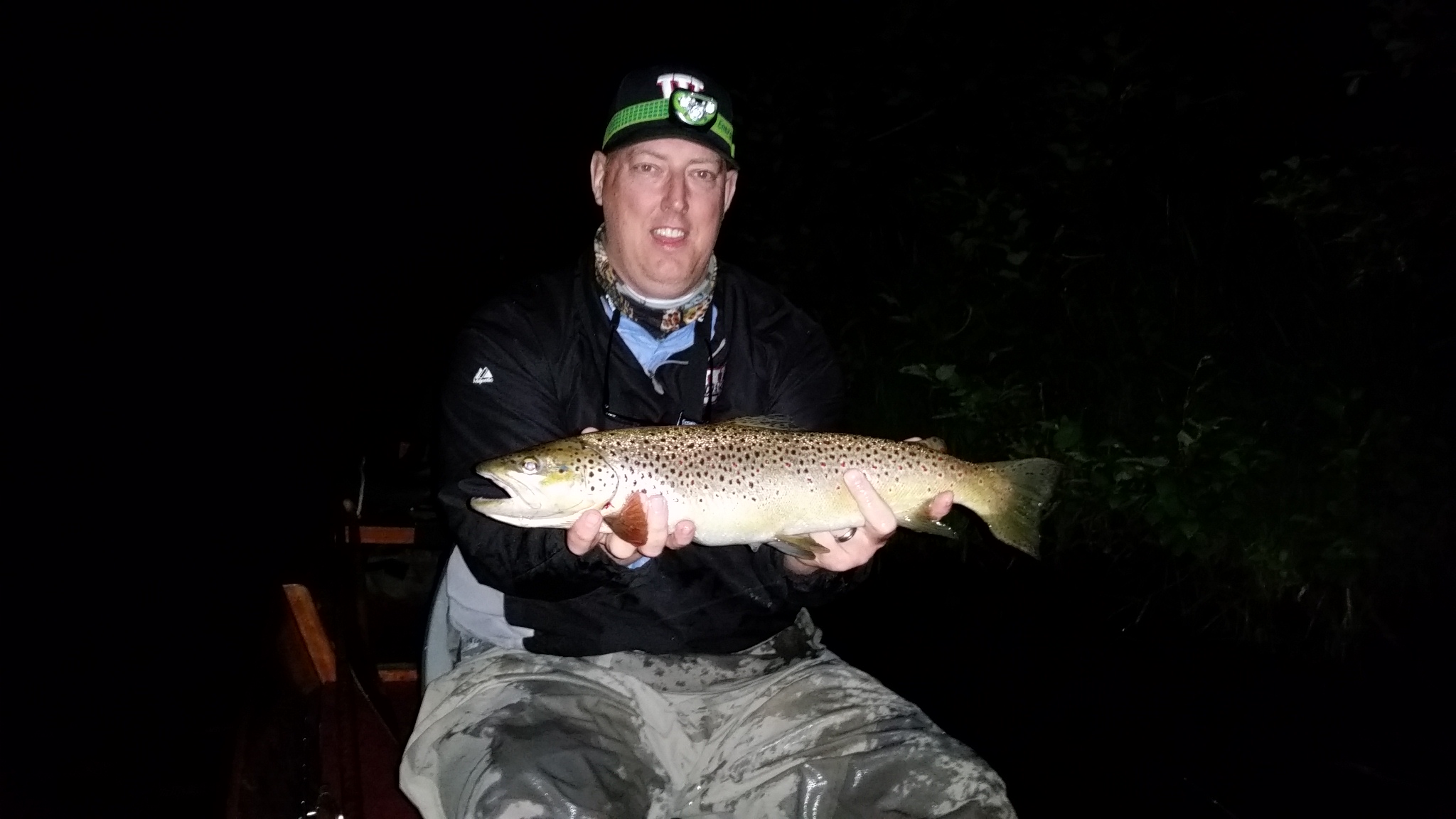 Tim Landeseld with a whopper of a brown caught on a bamboo rod his uncle made. 